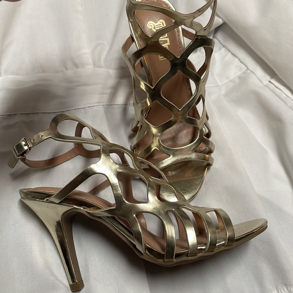 Brash gold cutout heels